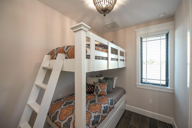 340 Jackson Dr, Sarasota, FL 34236 - bedroom with baseboards and dark wood-style flooring