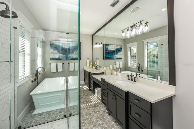 340 Jackson Dr, Sarasota, FL 34236 - bathroom featuring vanity, a stall shower, a soaking tub, and baseboards