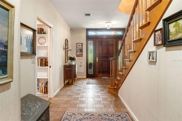 1671 S Dr, Sarasota, FL 34239 - foyer with stairs and baseboards