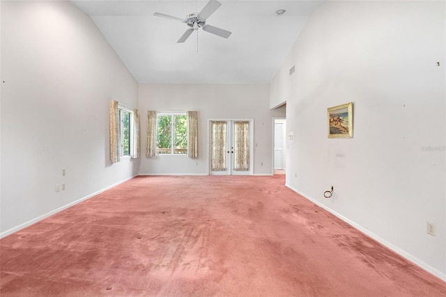 1671 S Dr, Sarasota, FL 34239 - unfurnished room with high vaulted ceiling, ceiling fan, light carpet, french doors, and baseboards