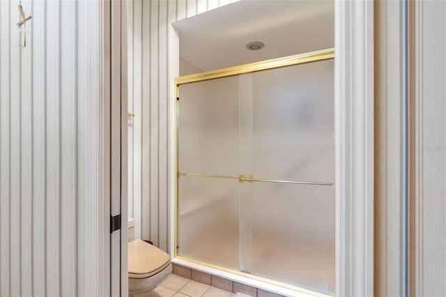 1671 S Dr, Sarasota, FL 34239 - bathroom featuring toilet, a shower stall, and tile patterned flooring