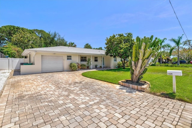 1324 Augusta Ln S, Saint Petersburg, FL 33707 - view of front of property featuring decorative driveway, an attached garage, and stucco siding