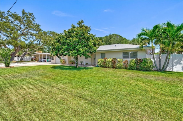 1324 Augusta Ln S, Saint Petersburg, FL 33707 - back of property with concrete driveway and stucco siding