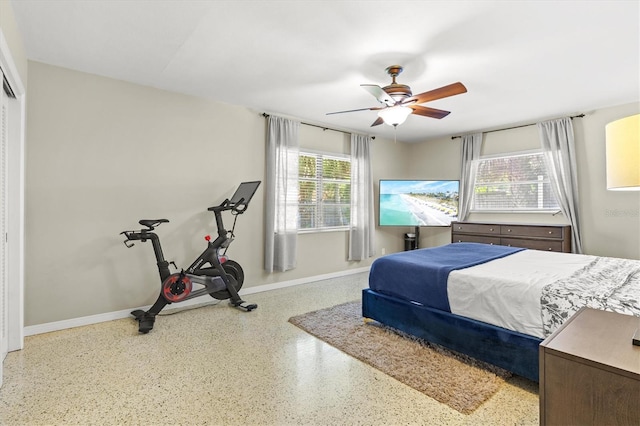1324 Augusta Ln S, Saint Petersburg, FL 33707 - bedroom featuring speckled floor, baseboards, and a ceiling fan