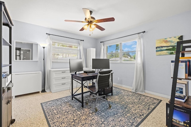 1324 Augusta Ln S, Saint Petersburg, FL 33707 - office space featuring a ceiling fan, dark aggregate flooring, and baseboards