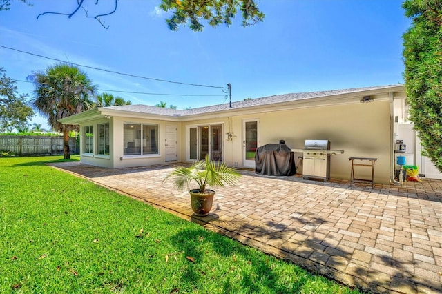 1324 Augusta Ln S, Saint Petersburg, FL 33707 - back of property with a patio area and stucco siding
