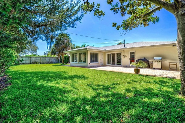 1324 Augusta Ln S, Saint Petersburg, FL 33707 - rear view of house with a patio area and stucco siding