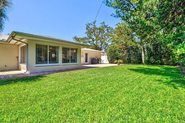 1324 Augusta Ln S, Saint Petersburg, FL 33707 - view of green lawn featuring a patio