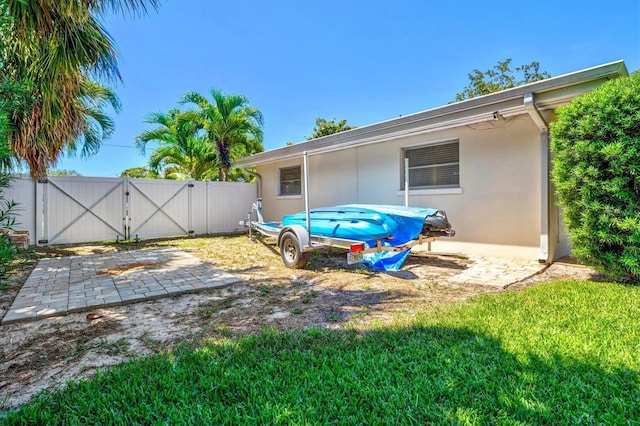 1324 Augusta Ln S, Saint Petersburg, FL 33707 - view of yard featuring a gate and a patio