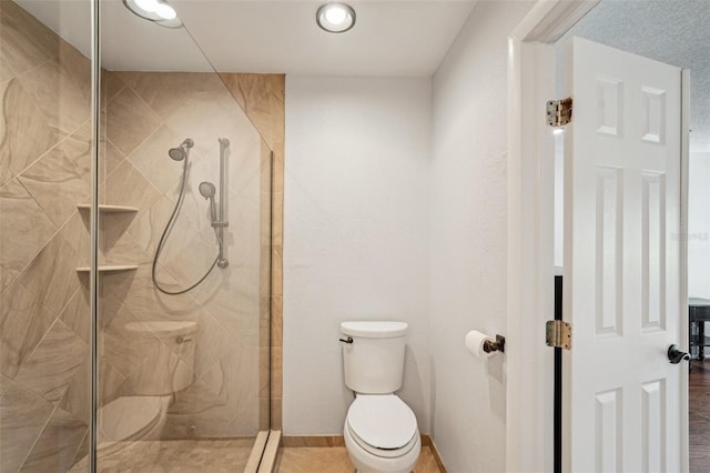 532 Oak Hill Cir Unit 12, Sarasota, FL 34232 - full bath with toilet, a shower stall, and baseboards