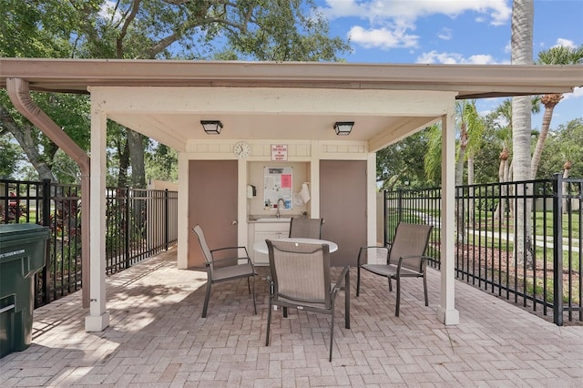 532 Oak Hill Cir Unit 12, Sarasota, FL 34232 - view of patio / terrace featuring outdoor dining space and a sink