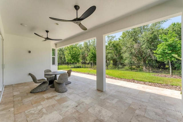 8069 Tidal Pointe Way, Sarasota, FL 34240 - view of patio / terrace with ceiling fan, outdoor dining space, and view of scattered trees