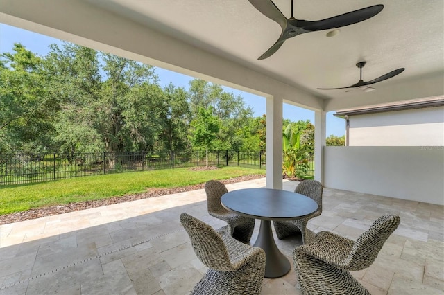 8069 Tidal Pointe Way, Sarasota, FL 34240 - view of patio featuring a ceiling fan and view of wooded area