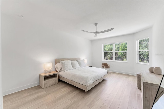 8069 Tidal Pointe Way, Sarasota, FL 34240 - bedroom featuring baseboards, light wood-style floors, and ceiling fan