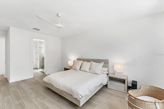 8069 Tidal Pointe Way, Sarasota, FL 34240 - bedroom with light wood-type flooring, baseboards, and a ceiling fan