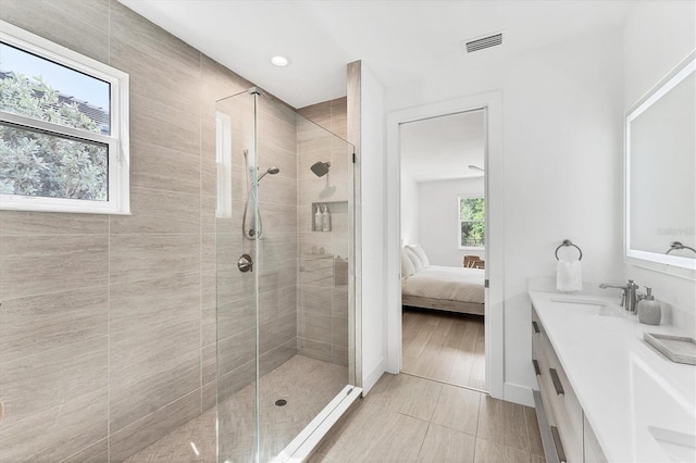 8069 Tidal Pointe Way, Sarasota, FL 34240 - ensuite bathroom with vanity, a shower stall, tile patterned floors, and recessed lighting