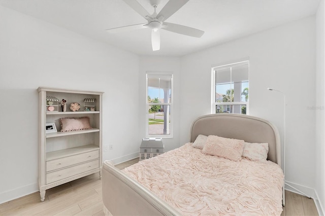 8069 Tidal Pointe Way, Sarasota, FL 34240 - bedroom featuring light wood-style flooring, baseboards, and a ceiling fan