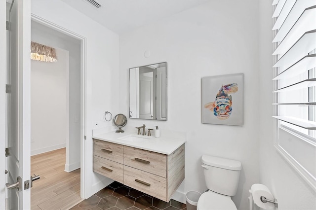 8069 Tidal Pointe Way, Sarasota, FL 34240 - bathroom with vanity, toilet, and baseboards