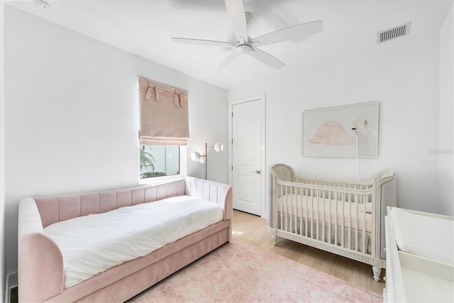 8069 Tidal Pointe Way, Sarasota, FL 34240 - bedroom featuring wood finished floors and a ceiling fan