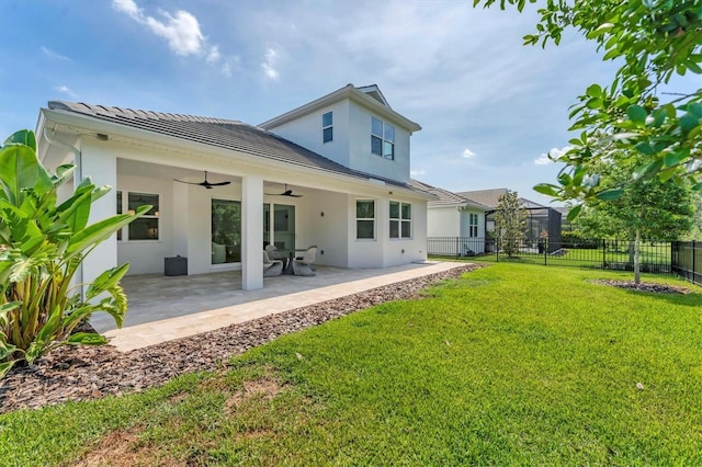 8069 Tidal Pointe Way, Sarasota, FL 34240 - rear view of house with a ceiling fan, stucco siding, and a patio