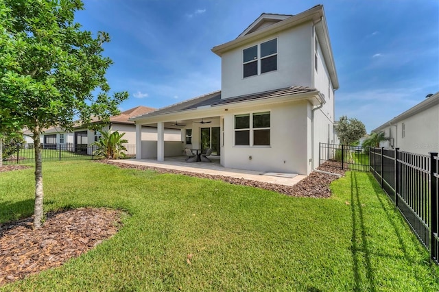 8069 Tidal Pointe Way, Sarasota, FL 34240 - back of property featuring ceiling fan, stucco siding, and a patio