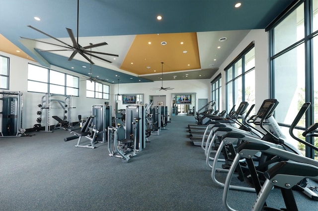 8069 Tidal Pointe Way, Sarasota, FL 34240 - exercise room featuring ceiling fan, a high ceiling, recessed lighting, and a raised ceiling