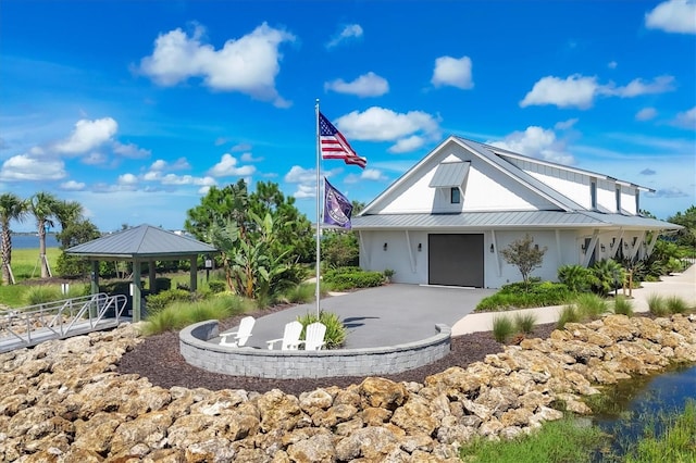 8069 Tidal Pointe Way, Sarasota, FL 34240 - view of property's community with a gazebo, asphalt driveway, and a garage