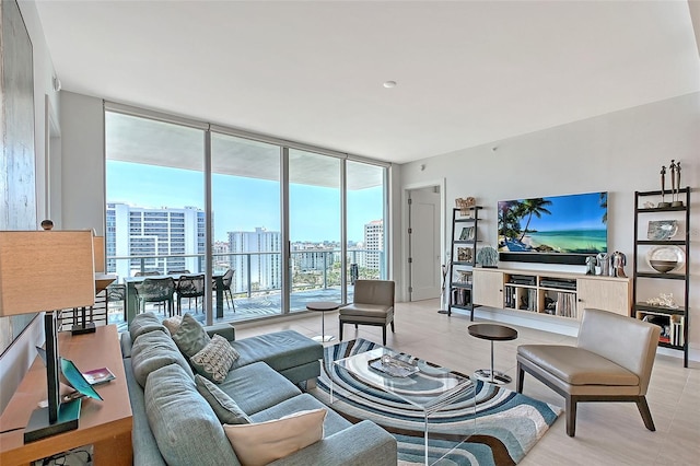 301 Quay Commons Unit 1208, Sarasota, FL 34236 - living room featuring a wall of windows and light tile patterned floors