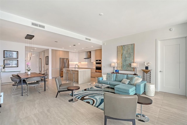 301 Quay Commons Unit 1208, Sarasota, FL 34236 - living area featuring light tile patterned flooring and recessed lighting