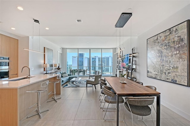 301 Quay Commons Unit 1208, Sarasota, FL 34236 - dining room featuring expansive windows, recessed lighting, and baseboards