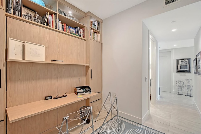 301 Quay Commons Unit 1208, Sarasota, FL 34236 - office with light tile patterned floors, built in study area, baseboards, and recessed lighting