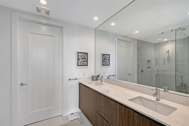 301 Quay Commons Unit 1208, Sarasota, FL 34236 - full bathroom with a shower stall, double vanity, recessed lighting, and baseboards