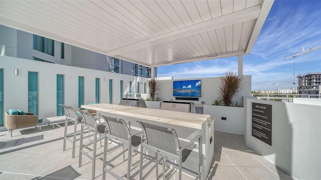301 Quay Commons Unit 1208, Sarasota, FL 34236 - view of patio / terrace with outdoor dining area