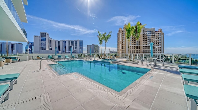 301 Quay Commons Unit 1208, Sarasota, FL 34236 - view of swimming pool with a city view and a pool with connected hot tub