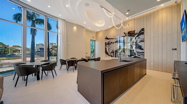 301 Quay Commons Unit 1208, Sarasota, FL 34236 - office with a sink, recessed lighting, a high ceiling, plenty of natural light, and expansive windows