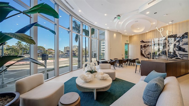 301 Quay Commons Unit 1208, Sarasota, FL 34236 - common area featuring floor to ceiling windows, recessed lighting, a high ceiling, and wood walls