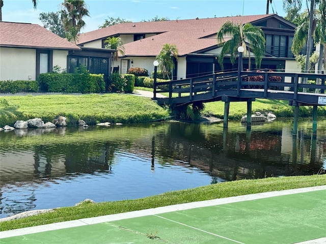 5400 34th St W Unit H12, Bradenton, FL 34210 - dock with a water view and a yard