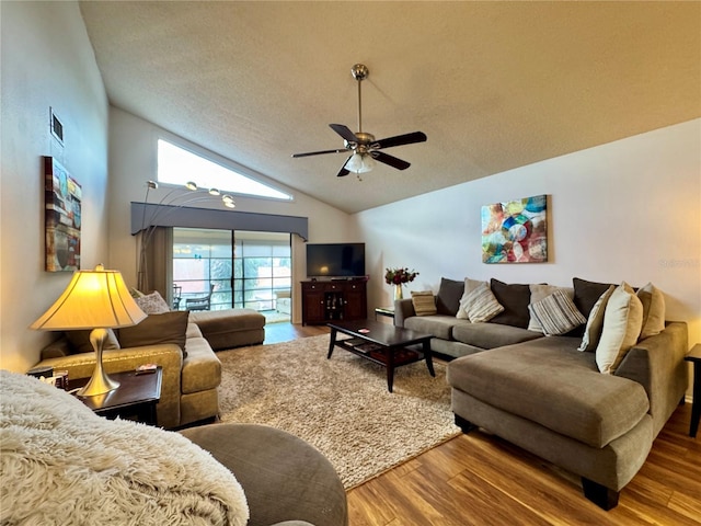 5400 34th St W Unit H12, Bradenton, FL 34210 - living room featuring lofted ceiling, a ceiling fan, wood finished floors, and a textured ceiling