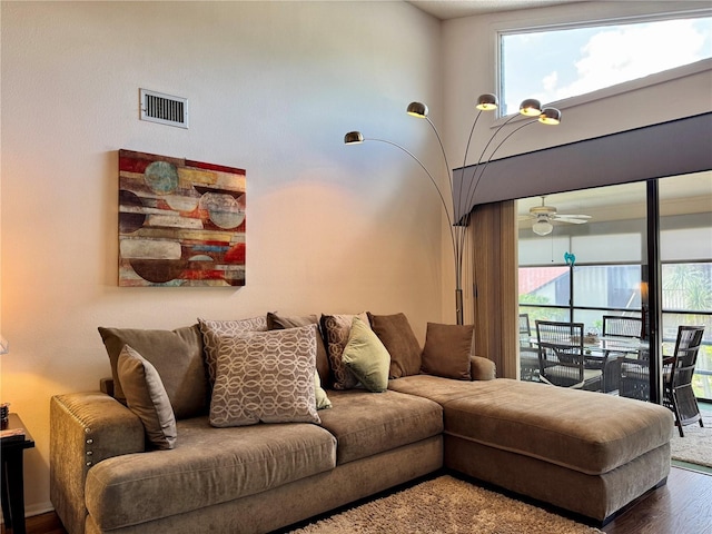 5400 34th St W Unit H12, Bradenton, FL 34210 - living area featuring plenty of natural light, wood finished floors, and ceiling fan