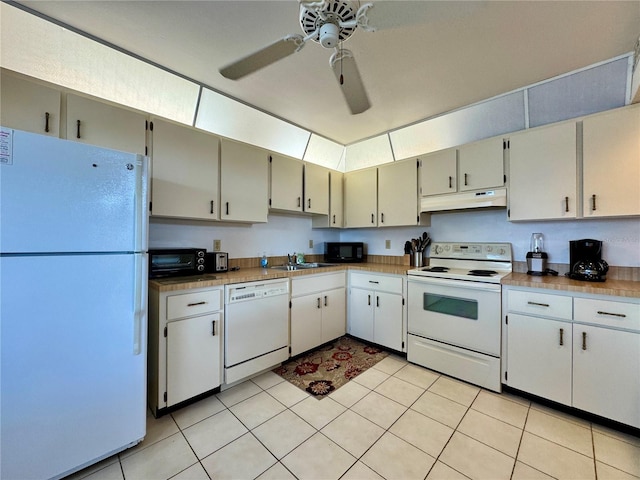 5400 34th St W Unit H12, Bradenton, FL 34210 - kitchen with white appliances, under cabinet range hood, a ceiling fan, light tile patterned floors, and light countertops