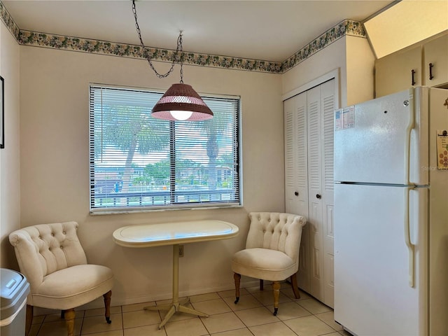 5400 34th St W Unit H12, Bradenton, FL 34210 - dining space featuring light tile patterned floors and baseboards