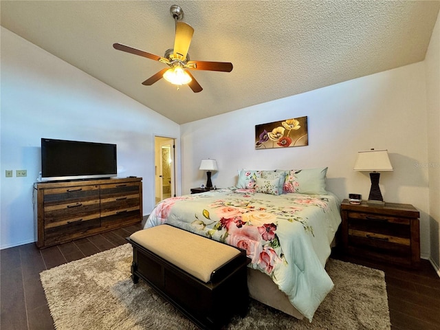 5400 34th St W Unit H12, Bradenton, FL 34210 - bedroom featuring wood finished floors, lofted ceiling, a ceiling fan, ensuite bathroom, and a textured ceiling