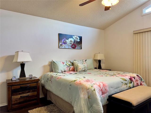 5400 34th St W Unit H12, Bradenton, FL 34210 - bedroom featuring a textured ceiling, dark wood-style floors, and ceiling fan