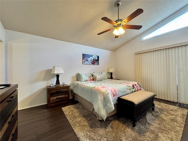 5400 34th St W Unit H12, Bradenton, FL 34210 - bedroom featuring vaulted ceiling, dark wood-style floors, a textured ceiling, and a ceiling fan