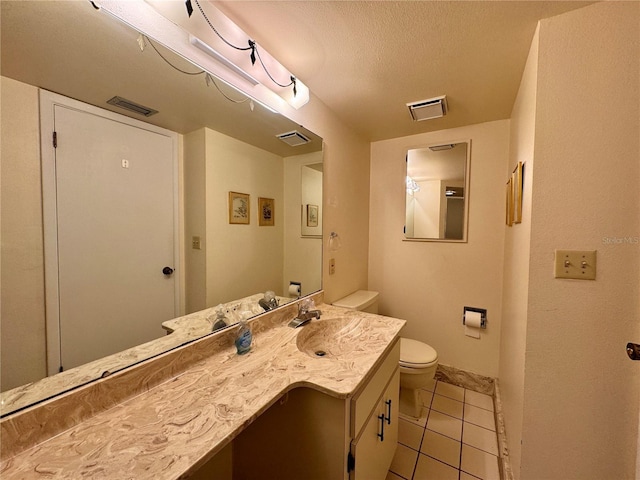 5400 34th St W Unit H12, Bradenton, FL 34210 - bathroom featuring tile patterned floors, vanity, and a textured ceiling