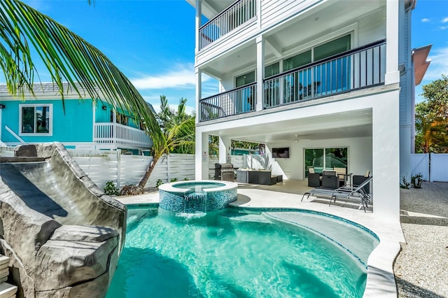5219 Calle Menorca, Sarasota, FL 34242 - view of pool with a ceiling fan, a fenced backyard, a patio, an outdoor hangout area, and a pool with connected hot tub
