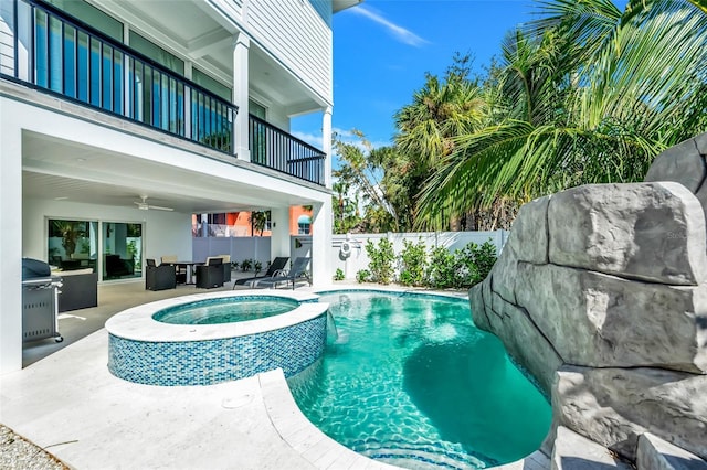 5219 Calle Menorca, Sarasota, FL 34242 - view of pool with a fenced backyard, a ceiling fan, a patio, and a pool with connected hot tub