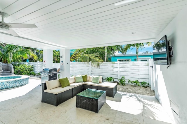 5219 Calle Menorca, Sarasota, FL 34242 - fenced backyard featuring a grill, a patio area, an outdoor living space, and ceiling fan