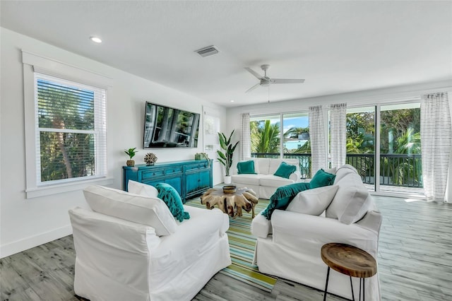 5219 Calle Menorca, Sarasota, FL 34242 - living room with plenty of natural light, baseboards, wood finished floors, a ceiling fan, and recessed lighting