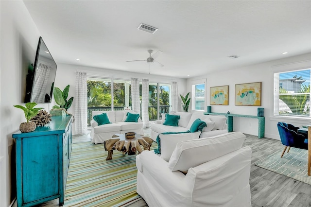 5219 Calle Menorca, Sarasota, FL 34242 - living area with ceiling fan, recessed lighting, light wood-style flooring, and baseboards